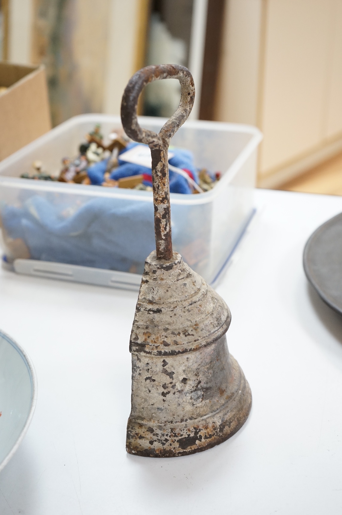 A 19th century cast iron bell shaped door stop, 29cm high